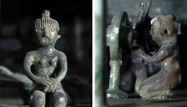 Bronze model house with musicians and performers