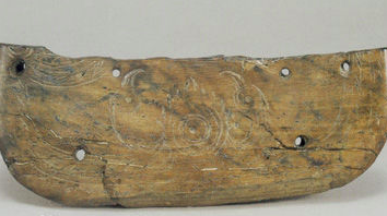 Dish-shaped ivory object adorned with two birds worshipping the sun