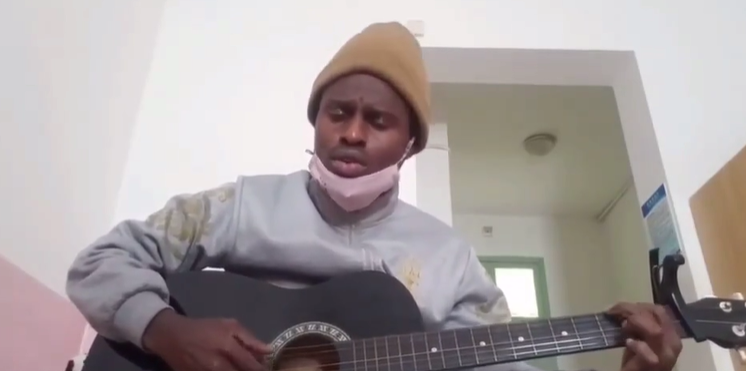 An international student at Lishui University composes a freestyle song to cheer people up