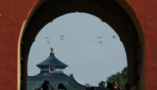 March-past of China's V-Day parade begins with flag-guarding echelon flying over Tian'anmen Square