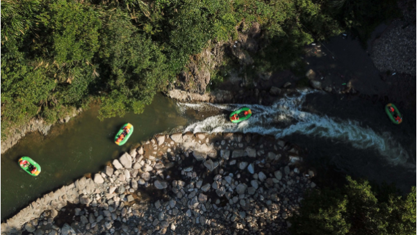 Tourists enjoy drifting in valley in Zhejiang